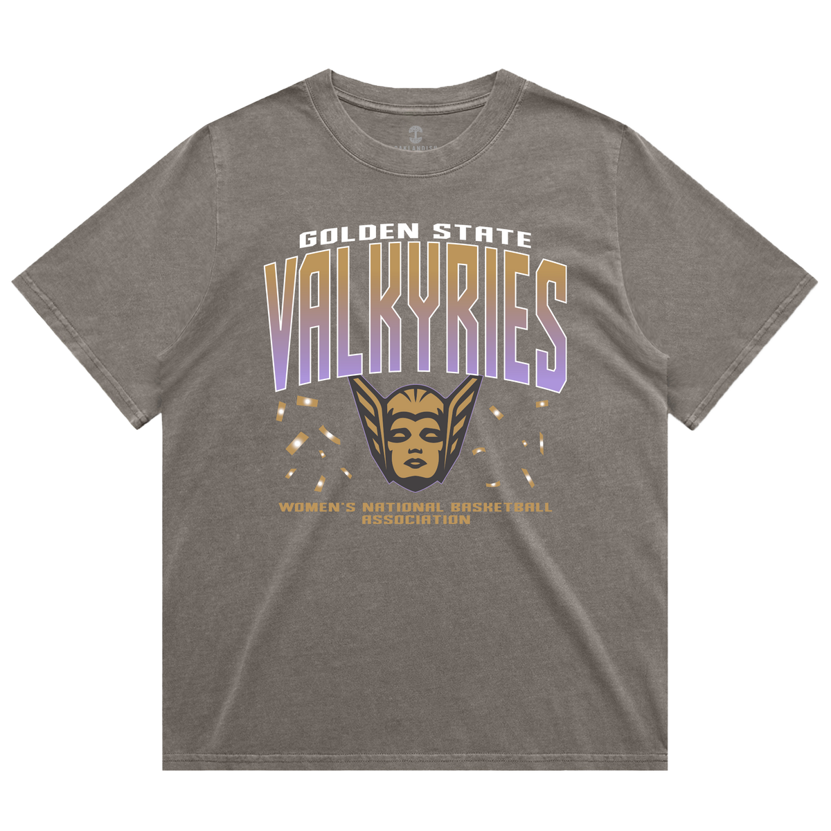 The GSV Women’s First Flight Tee by GSV features an oversized fit in gray, showcasing “Golden State Valkyries” in bold white and purple lettering, a striking gold valkyrie face with wings, and “Women’s National Basketball Association” in smaller gold text beneath. This heavy-weight tee offers both comfort and style for dedicated Golden State Valkyries fans.