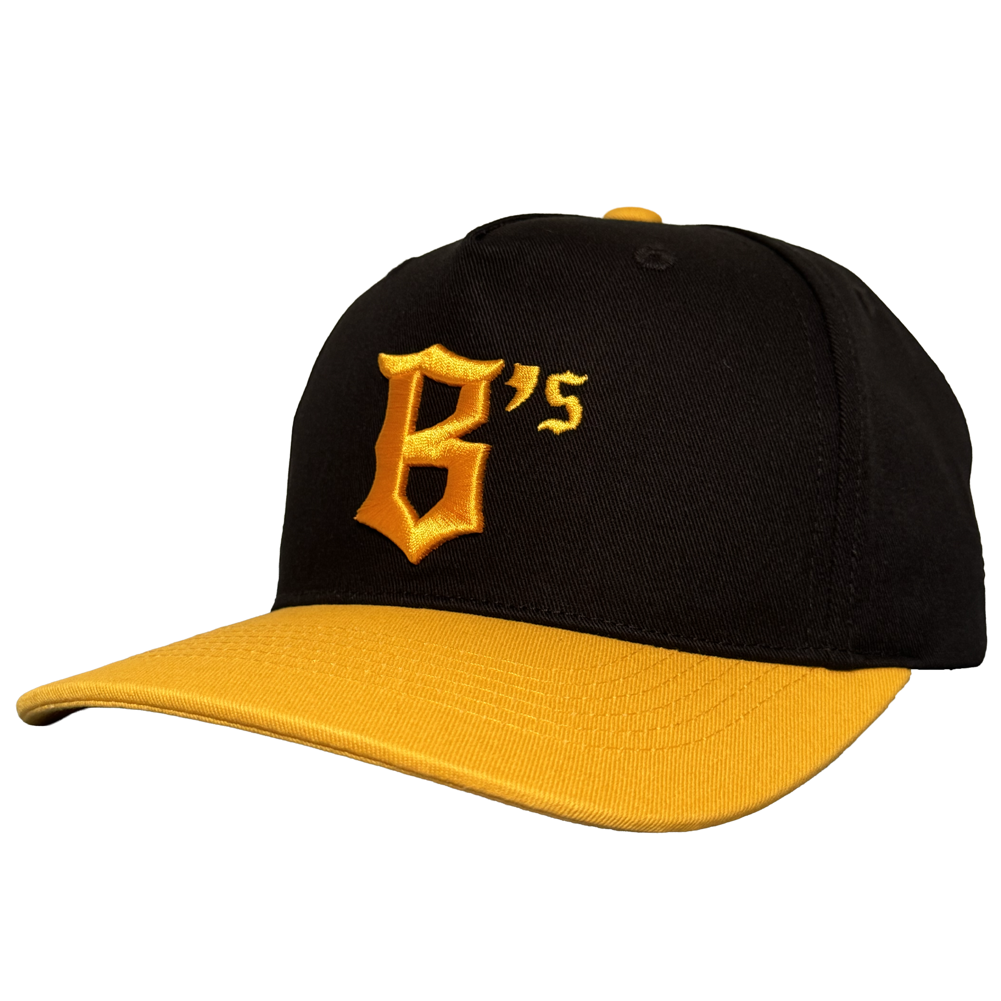 The Oakland Ballers 5 Panel Cap by Oakland Ballers features a black snapback design with a yellow brim and button, showcasing a bold yellow "B’s" stitched on the front left, inspired by the team. The cap is angled left on a plain white background.