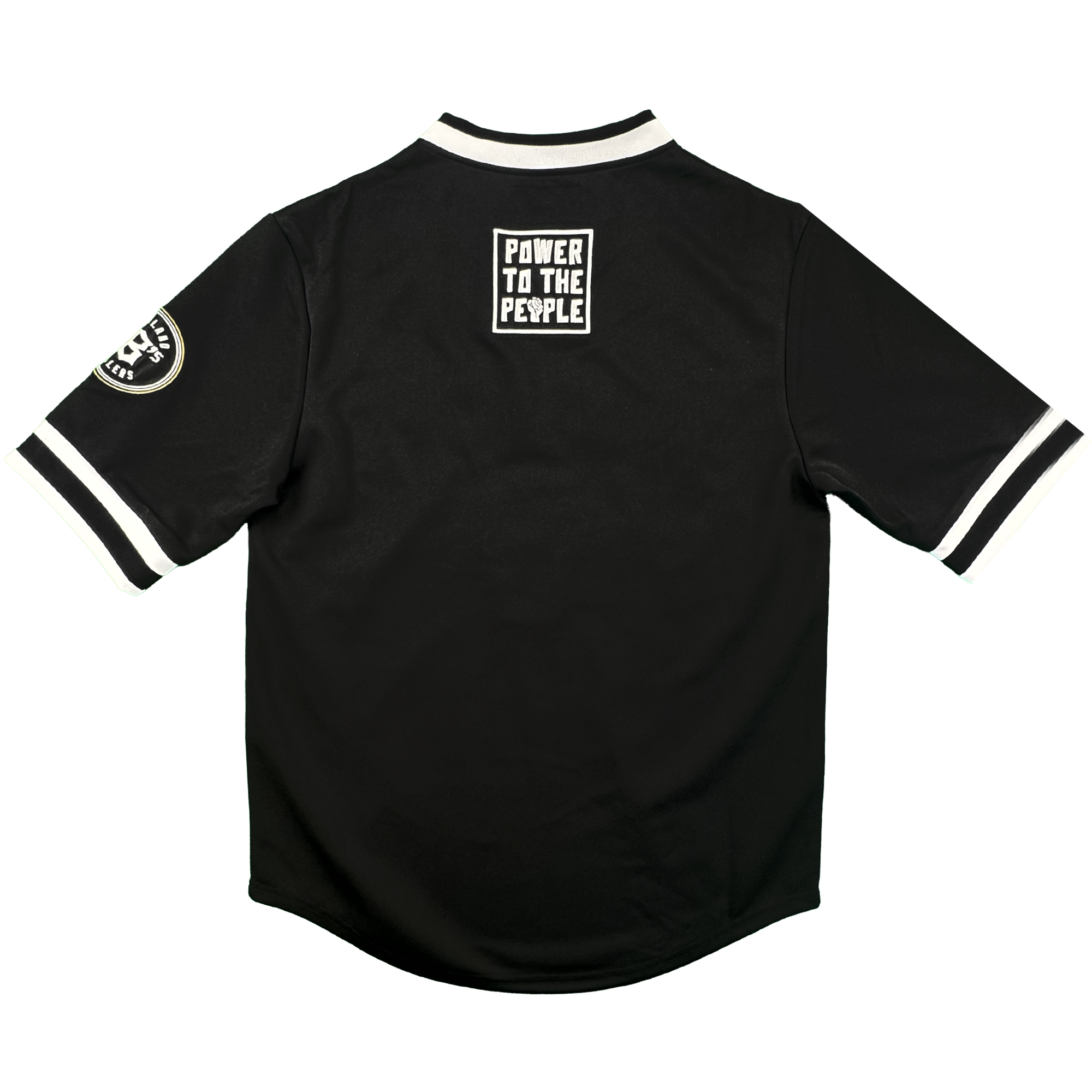 The Stands Up Jersey by Oakland Ballers is a black short-sleeved shirt with white trim, a “POWER TO THE PEOPLE” patch on the upper back, and an Oakland Ballers circular patch on the left sleeve, shown on a plain white background.