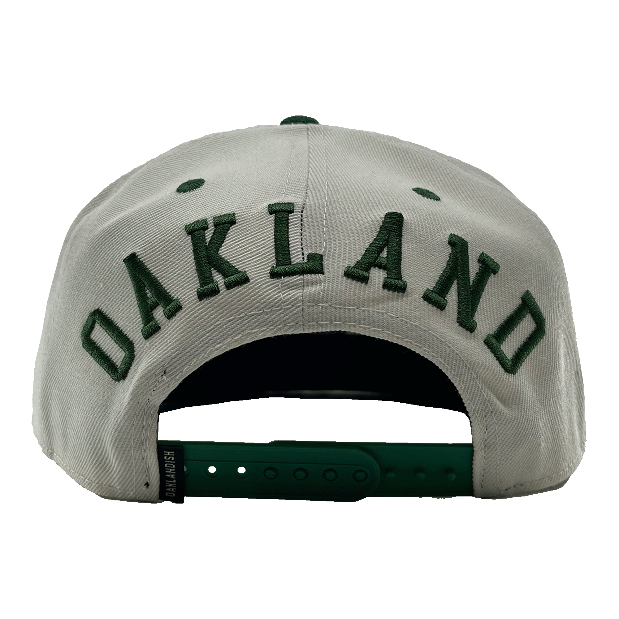 Back view of a white hat with a green adjustable snapback closure, large green embroidered OAKLANDISH wordmark, and small Oaklandish tag.