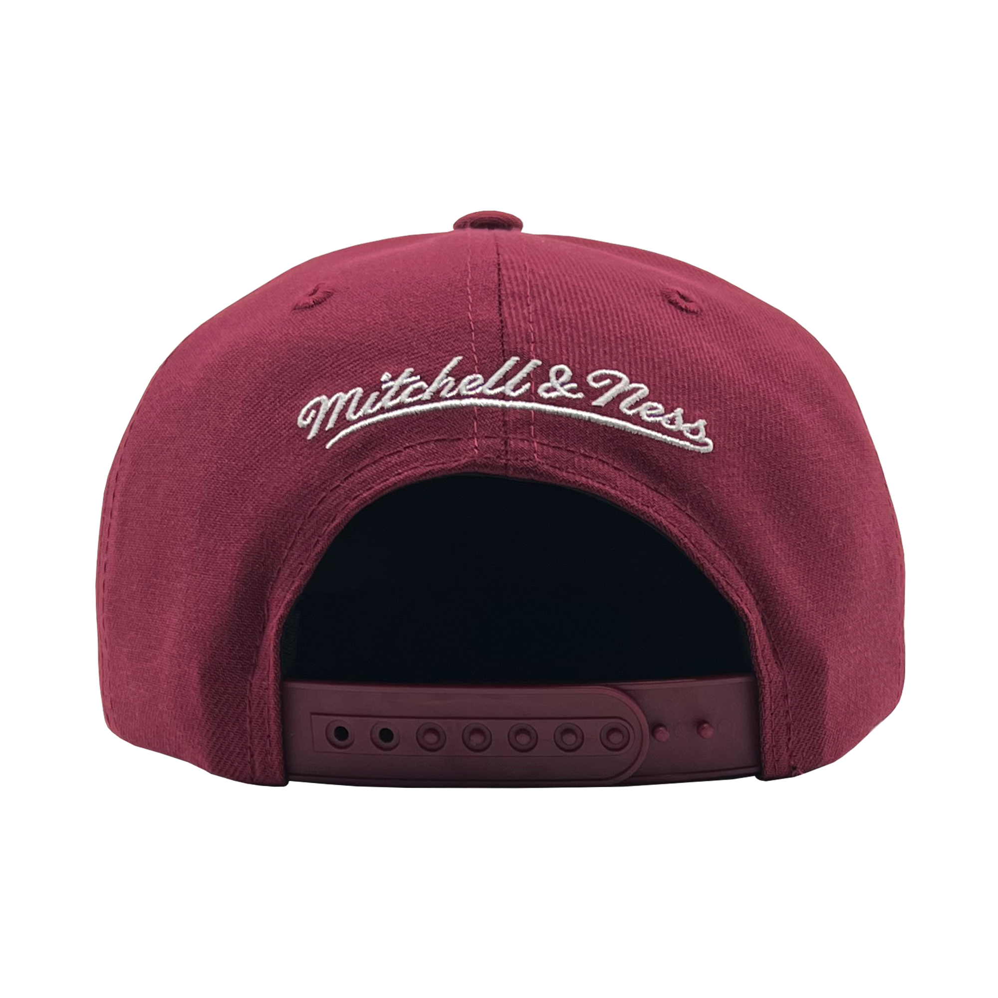 Back view of a cardinal red snapback cap with white embroidered Mitchell & Ness wordmark.