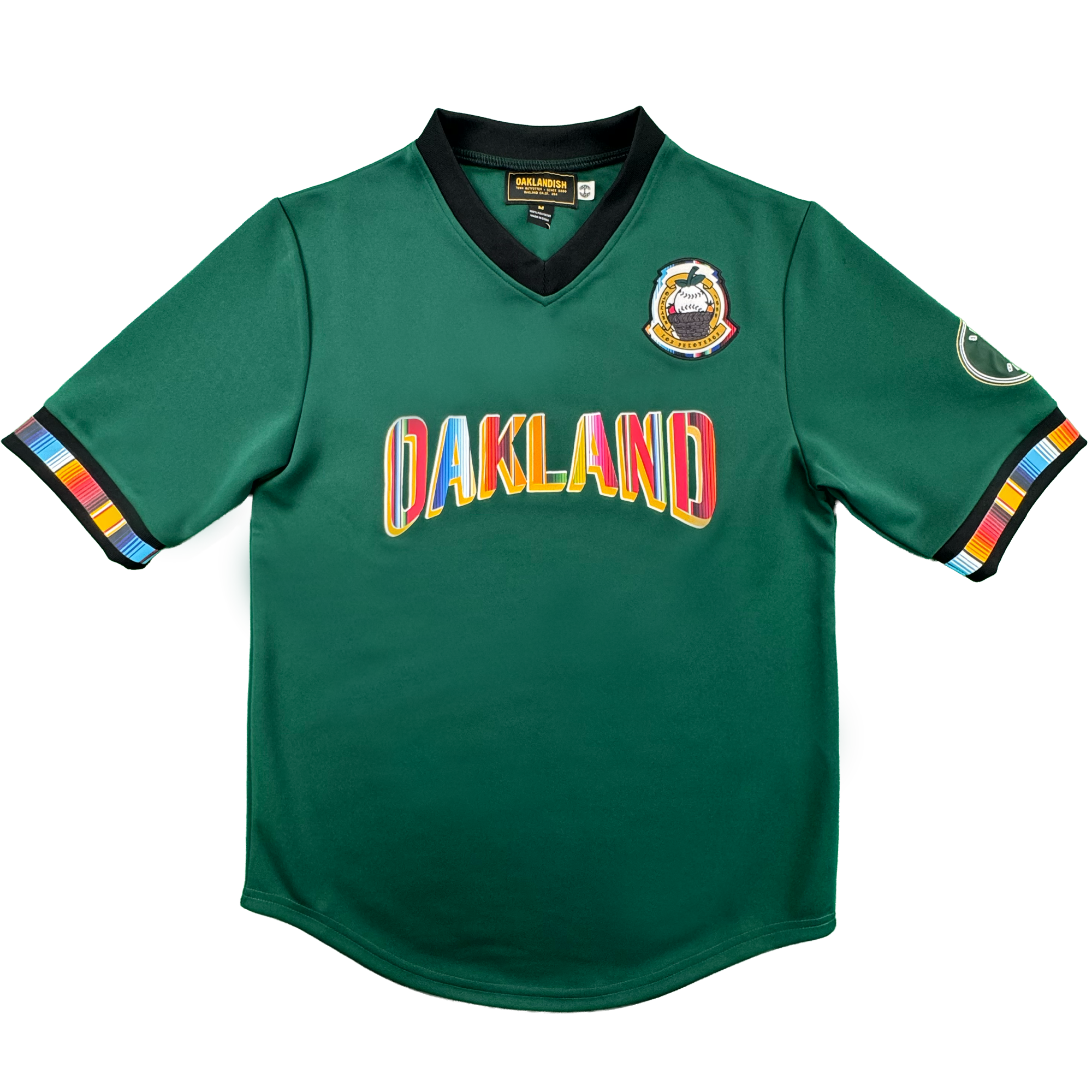 Introducing the Peloteros Jersey by Oakland Ballers: a vibrant green sports jersey inspired by the Oakland Ballers baseball team, featuring "OAKLAND" in multicolored letters across the front, a colorful badge on the left chest, an oval patch on the right sleeve, and black-trimmed sleeves and collar accented with multicolored stripes—a lively tribute to Pioneer League style.