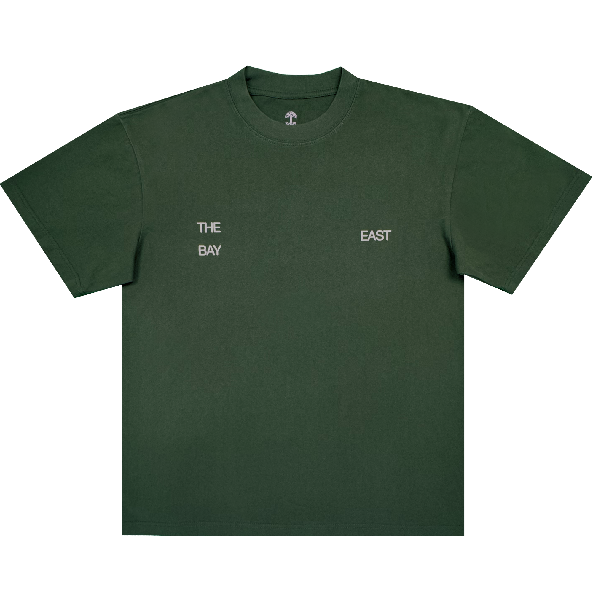 The East Bay Tee by Oaklandish is a dark green short-sleeve T-shirt from the Oaklandish x Toro y Moi collaboration, featuring small white text on the chest that reads "THE BAY" on the left and "EAST" on the right, separated by space. Inspired by Chaz Bear's unique style, this shirt is shown laid flat against a white background.