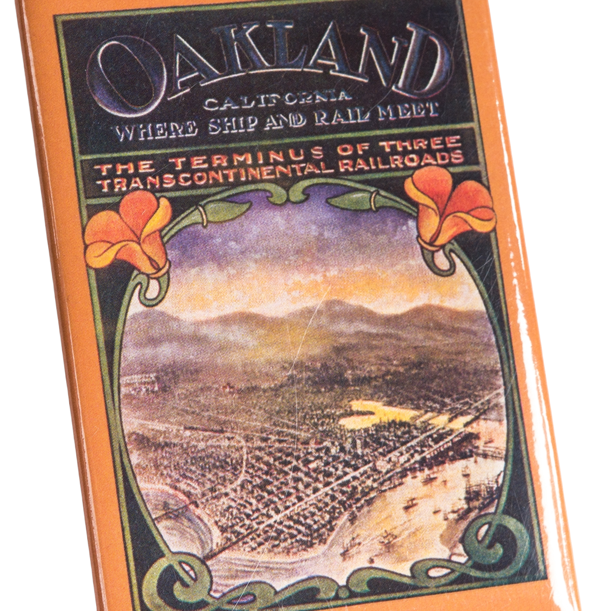 Add a touch of vintage charm to your collection with the Oaklandish Poppies Magnet, featuring bold “Oakland, California: Where Ship and Rail Meet” lettering. Showcasing an illustrated aerial view of early Oakland, framed by vivid orange poppies and decorative green scrolls, this magnet is inscribed with “The Terminus of Three Transcontinental Railroads.” Perfect as a unique Oakland souvenir or an eye-catching refrigerator accent, the Poppies Magnet makes a standout accessory for any vintage enthusiast.