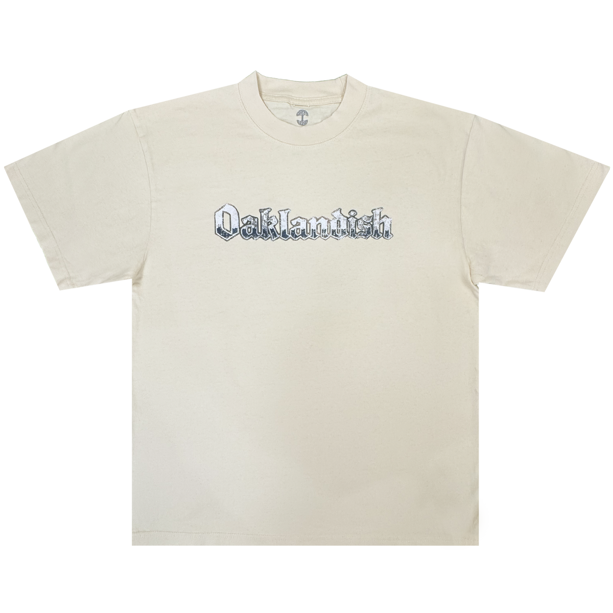A cream-colored classic fit t-shirt, the Oaklandish Swoop Tee features the brand’s name in bold black Old English-style lettering across the chest. Made from heavyweight cotton, this men’s tee—shown laid flat on a white background—boasts short sleeves and a crew neckline.