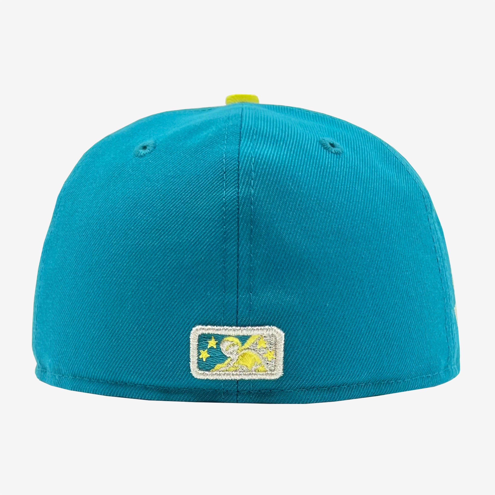 The image displays the back view of a blue New Era Oakland Oaks 59FIFTY Fitted Cap by Retail Vendors. This polyester cap includes two small, embroidered ventilation holes on each side. At the center of the cap's back, there is a rectangular embroidered patch featuring a star and mountain design in blue, white, and fluorescent yellow.